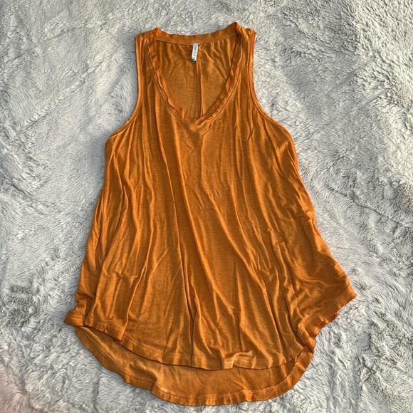 Flowy, burnt yellow/almost orange tank top. Slightly longer in the back! - Picture 1 of 3